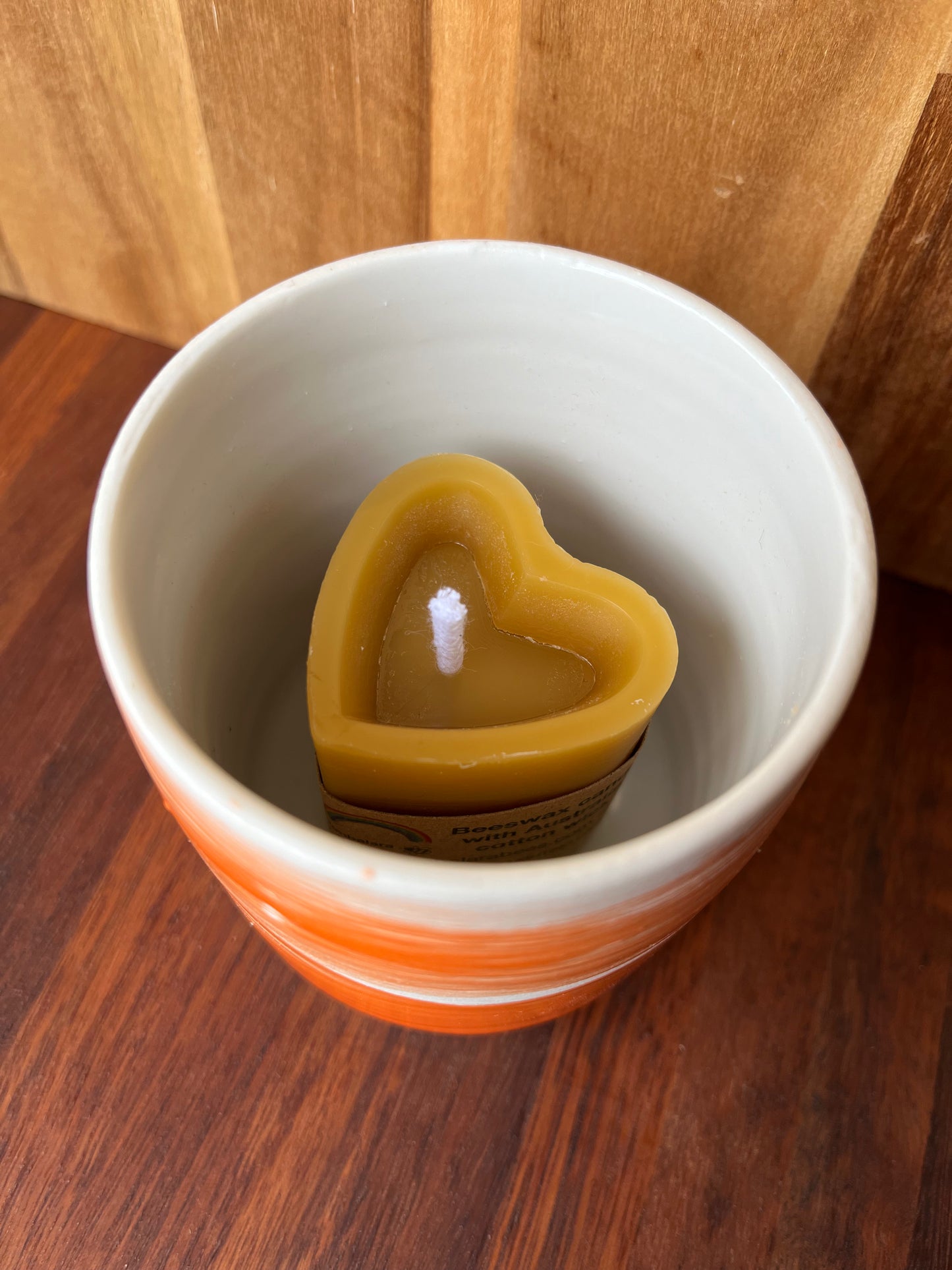 Beeswax heart shaped candle with ceramic holder orange