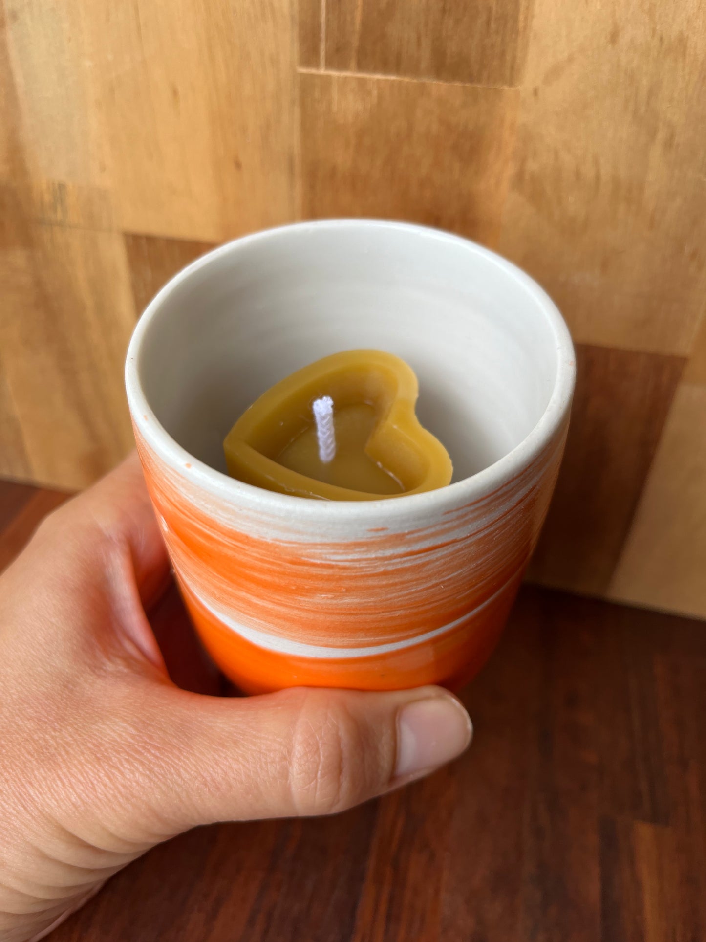 Beeswax heart shaped candle with ceramic holder orange