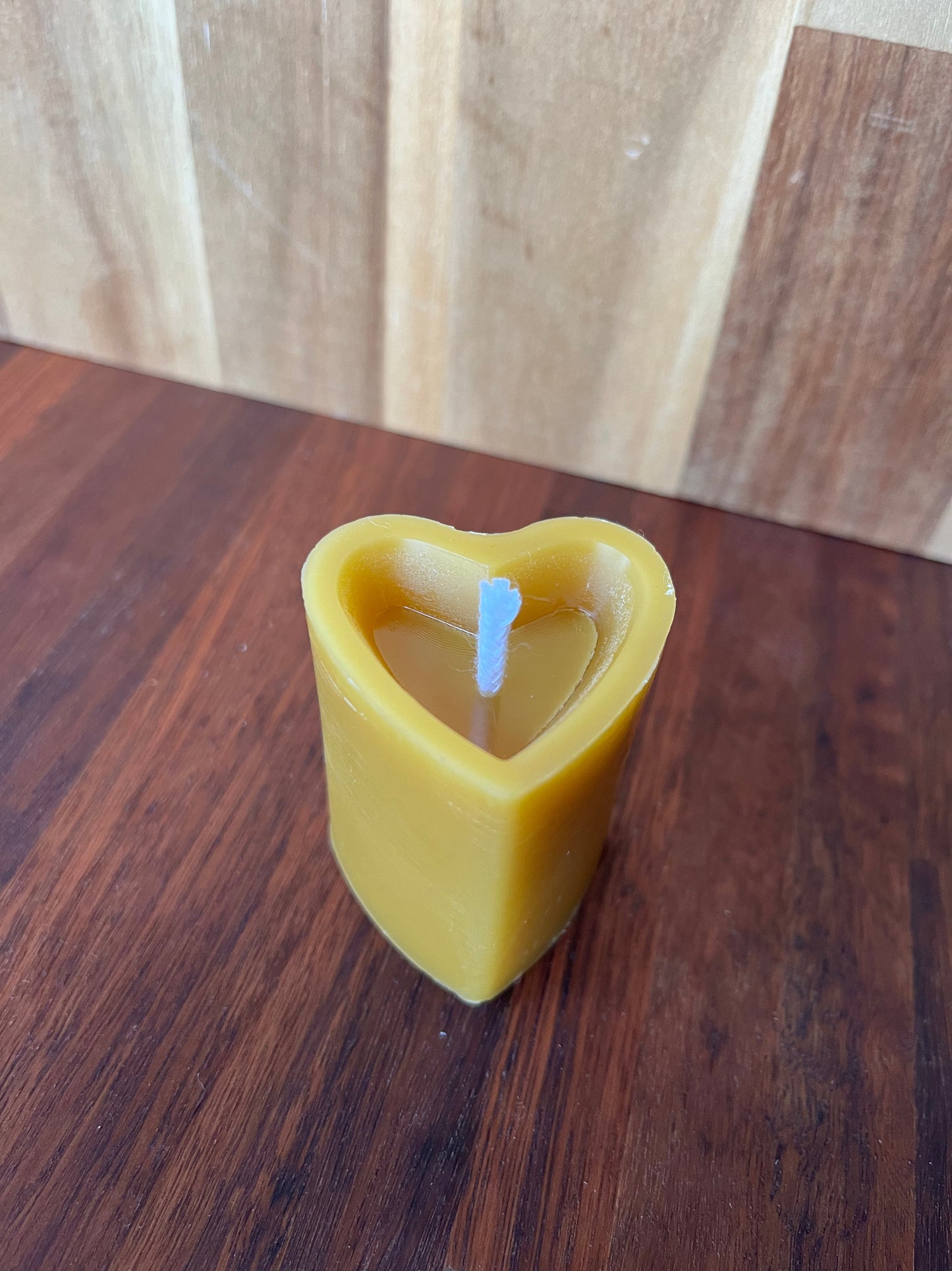 Beeswax heart shaped candle with ceramic holder orange